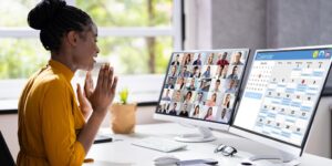 a lady sitting infront of a computer
